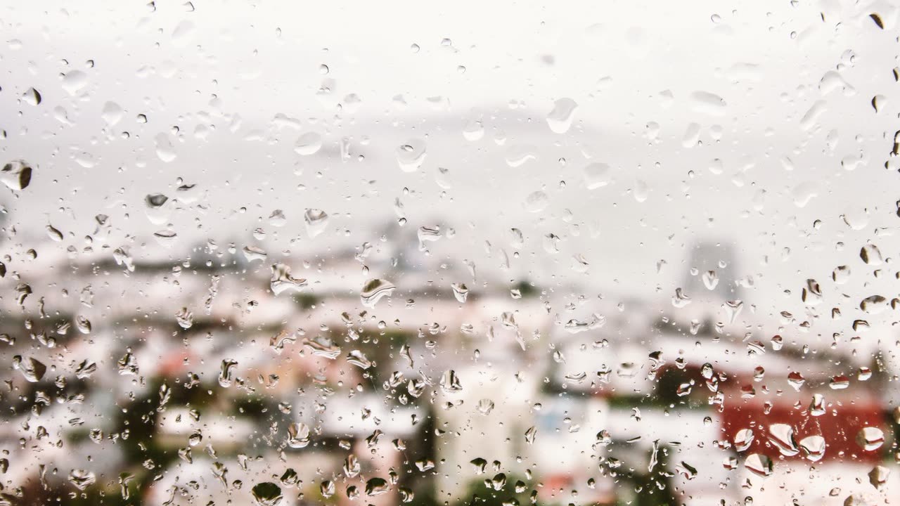 Rain on a softly lit window
